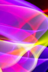 Neon Wavy Rainbow Swirls and Lines on Black Background