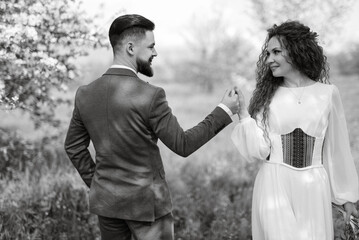 a bearded groom and a girl with green hair dance and twirl