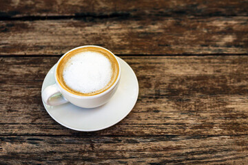 Flat Lay Hot cappuccino cup on wooden table,Top view