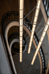 Elegant Chandelier Above a Spiral Staircase