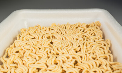 Fast food, Instant noodles, in a plastic plate, close-up.