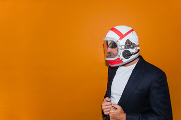 Businessman with astronaut helmet looking to the side