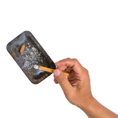 Holding a lit cigarette near an ashtray isolated on a transparent background