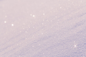 Abstract background pink snow surface sparkling in the morning sunlight