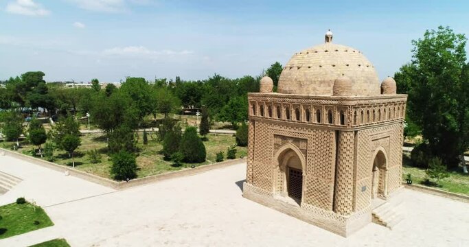 Drone flies around Ismoil Somoniy madrasah on a sunny day. Uzbekistan, Bukhara.