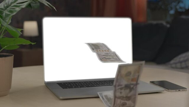 Money rain flying out of the laptop white screen. Make money online concept