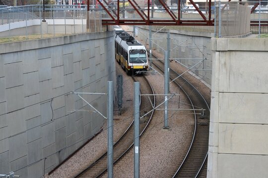A  Light Rail Train leaves SMU/Mockingbird Station headed north. Three lines use this station.