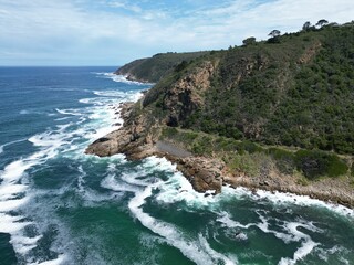 Fototapeta premium Aerial view of The Kaaimans River under a blue cloudy sky in South Africa