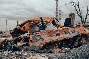 Fototapeta premium burnt tank and destroyed buildings of the Azovstal plant shop in Mariupol