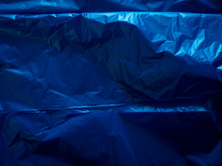Dark blue plastic bag texture for environmental background.