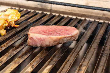 grilling picanha steak on the grill, brazilian barbecue