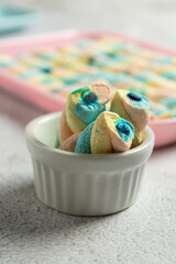 delicious marshmallows in colorful container