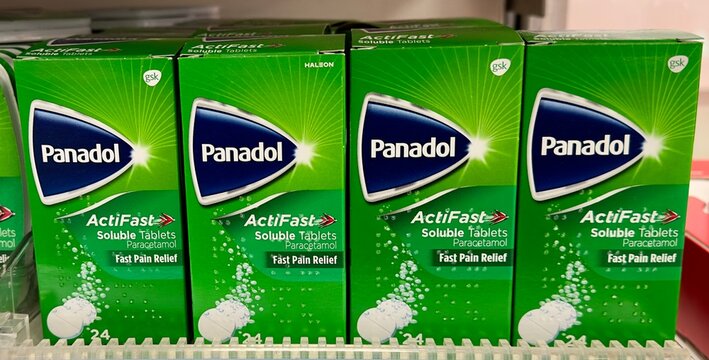 Essex, UK - January 19, 2024: Boxes of Panadol Actifast soluble tablets paracetamol fast pain relief on sale in a British chemist shop. 