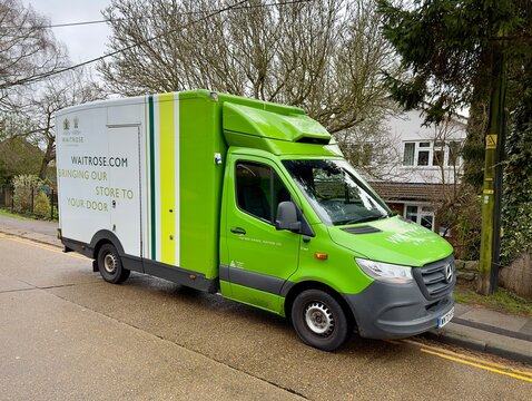 Billericay, UK - January 5, 2024: A Waitrose branded supermarket delivery van parked on a road in Billericay, Essex, England. 