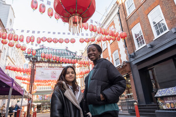 Portrait of two cheerful women in Chinatown
