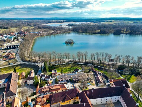 Aerial view of a bright blue lake in the city of Trebon, Czech Republic