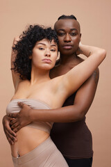 Studio portrait of happy lesbian couple