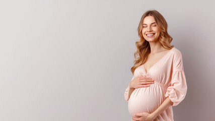 Caucasian pregnant woman with pregnancy belly, in soft pink clothes