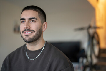 Smiling young man at home