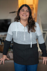 Smiling mature woman with long brown hair