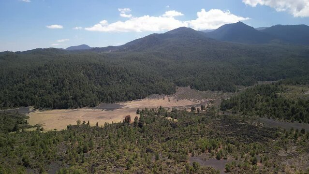 Drone footage of the Paricutin Volcano Viewpoint with green hills in Michoacan, Mexico