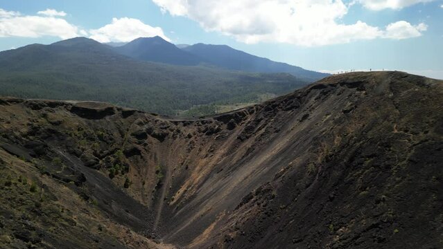 Drone footage of the Paricutin cinder cone volcano on a sunny day in Michoacan state, Mexico