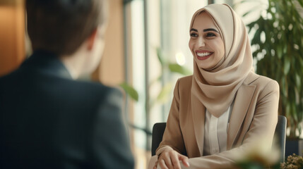 attractive modern Arabian businesswoman in traditional clothing working in office