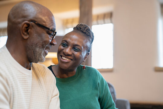 Smiling senior couple relaxing at home