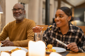 Family eating dinner together at home