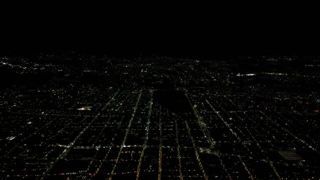 Aerial above the illuminated cityscape of Morelia at night in Michoacan, central Mexico
