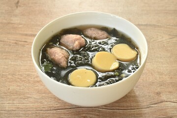 boiled egg tofu with mashed pork and seaweed soup on bowl 