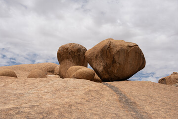 Fototapeta na wymiar magical beauty yellow mountains and huge yellow stones against the sky in the Namibian desert