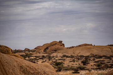 magical beauty yellow mountains and huge yellow stones against the sky in the Namibian desert
