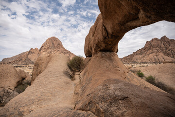 magical beauty yellow mountains and huge yellow stones against the sky in the Namibian desert