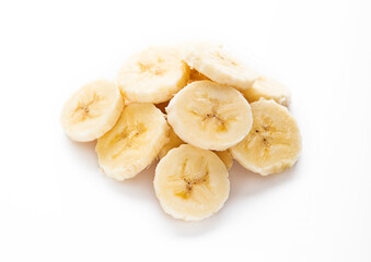 Naklejka na ściany i meble Fresh raw organic banana slices on white background.