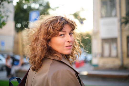 Face, smile and portrait of a woman happy in a park in summer for beauty, excited and confident in nature. garden and female person or model outdoor with freedom, happiness, style. High quality photo