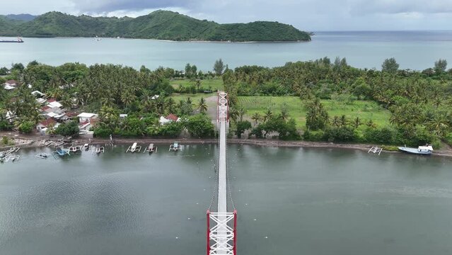 Suspension bridge for crossing

connecting Puyahan Village with Cemara Village. Lombok - NTB - Indonesia