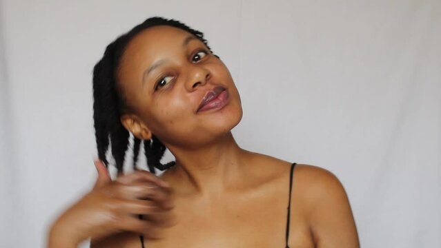 Black woman with twists on her natural 4c hair on a white background