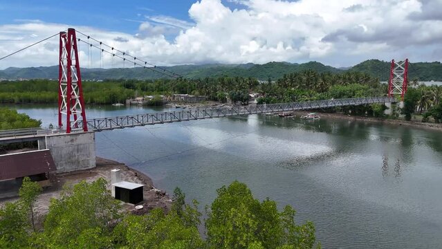 Suspension bridge for crossing

connecting Puyahan Village with Cemara Village. Lombok - NTB - Indonesia