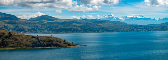 Breathtaking views of the shores of the Titicaca Lake with the mountains of the Cordillera Real in...