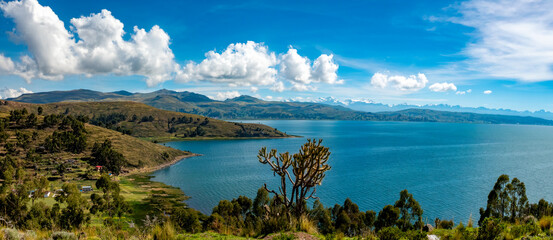 The shores of the Titicaca Lake with the  mountains of the Cordillera Real in the background,...