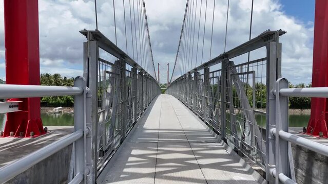 Suspension bridge for crossing

connecting Puyahan Village with Cemara Village. Lombok - NTB - Indonesia