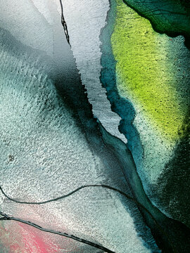 Abstract fluid art in green and turquoise tones. Hand-made with alcohol ink. Features organic flowing shapes. No real property or natural materials depicted.