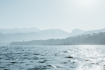 Obraz na płótnie Canvas Captivating Sorrento: Sunlit Coastal Majesty with Mountain Layers