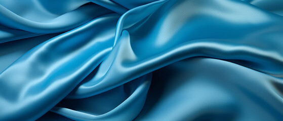Fototapeta premium Luxurious blue silk fabric with elegant wavy texture
