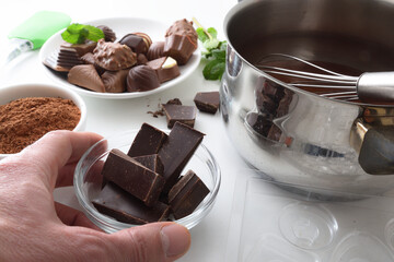 Making homemade chocolates on the kitchen bench with ingredients elevated