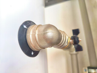 Close-Up of Domestic Water Shut-Off Valves. detailed view of the copper piping and two types of water shut-off valves typically installed in a home plumbing system