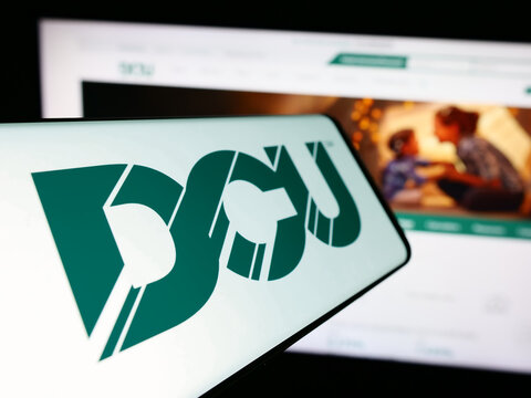 Stuttgart, Germany - 02-06-2024: Cellphone with logo of financial institution Digital Federal Credit Union (DCU) in front of website. Focus on center-left of phone display.