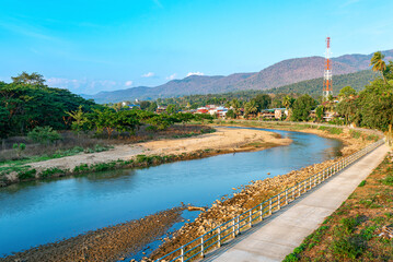 The beautiful small town of Mae Sariang on the Yuan River on the route of Mae Hong Son Loop in northern Thailand. Mae Sariang lies in the valley of Thanon Thong Chai Range near the border to Myanmar
