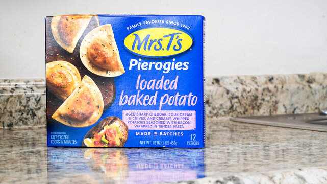 NORWALK, CT, USA - FEBRUARY 6, 2024:  Box with  pierogies loaded  with baked potatoes from Mrs T's brand on kitchen counter